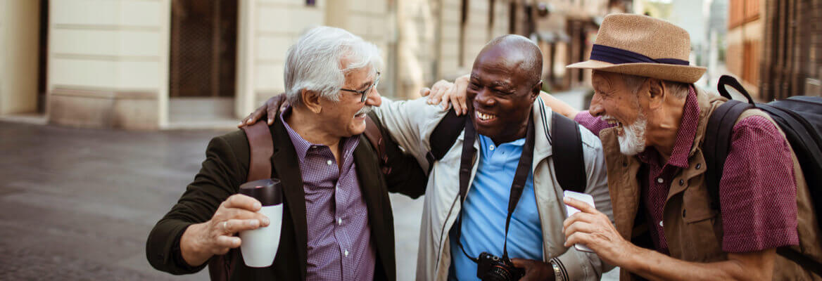 Three male senior tourists exploring the city